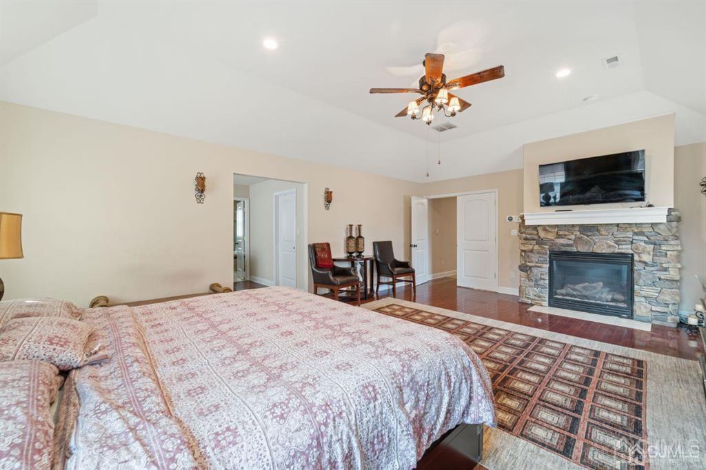 22 Utica Road Edison, NJ 08820 - Photo 20 of 28 a bed room with a bed and a fireplace