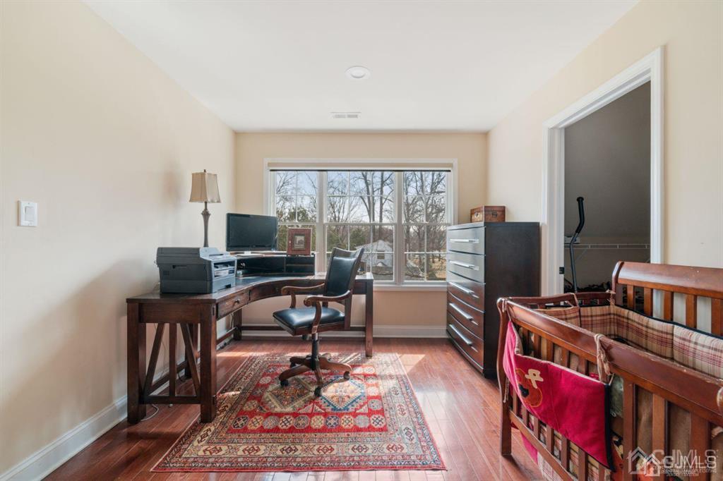 22 Utica Road Edison, NJ 08820 - Photo 21 of 28 a view of a workspace with furniture and a window
