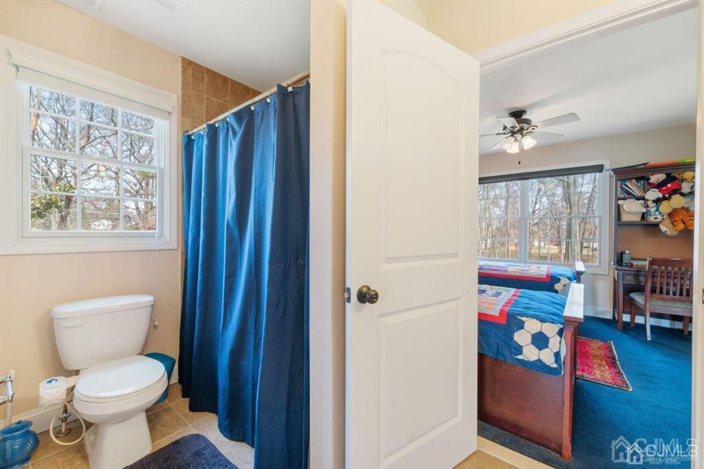 22 Utica Road Edison, NJ 08820 - Photo 24 of 28 a bathroom with a toilet sink and a shower