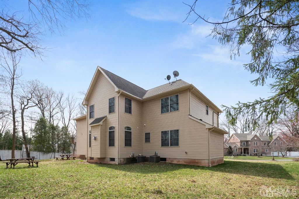 22 Utica Road Edison, NJ 08820 - Photo 3 of 28 a view of a white house with a big yard