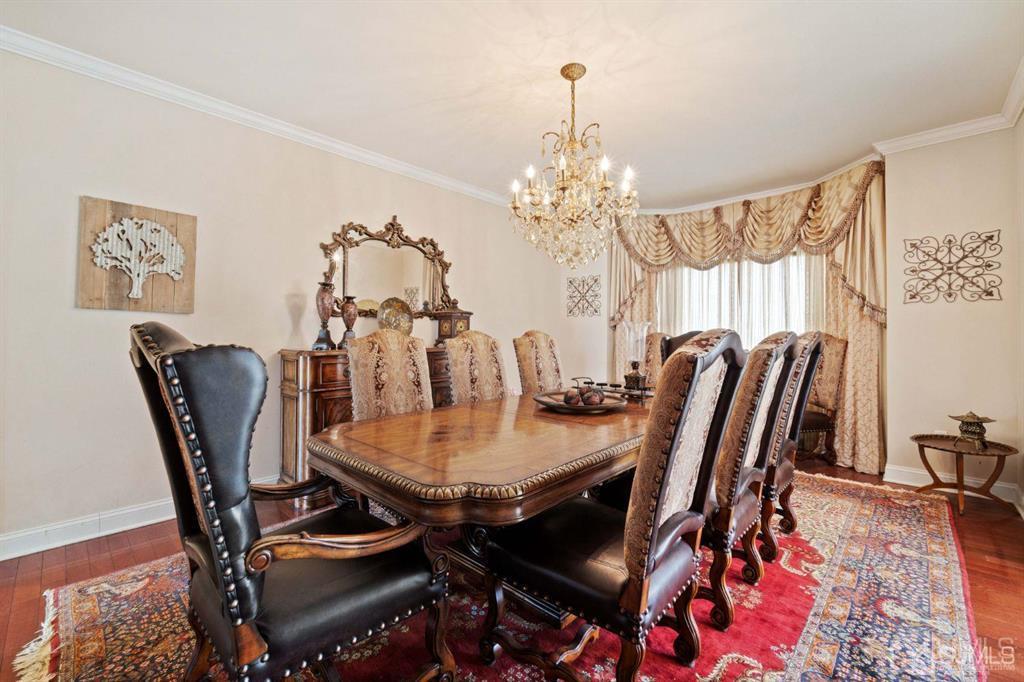 22 Utica Road Edison, NJ 08820 - Photo 9 of 28 a view of a dining room with furniture and chandelier