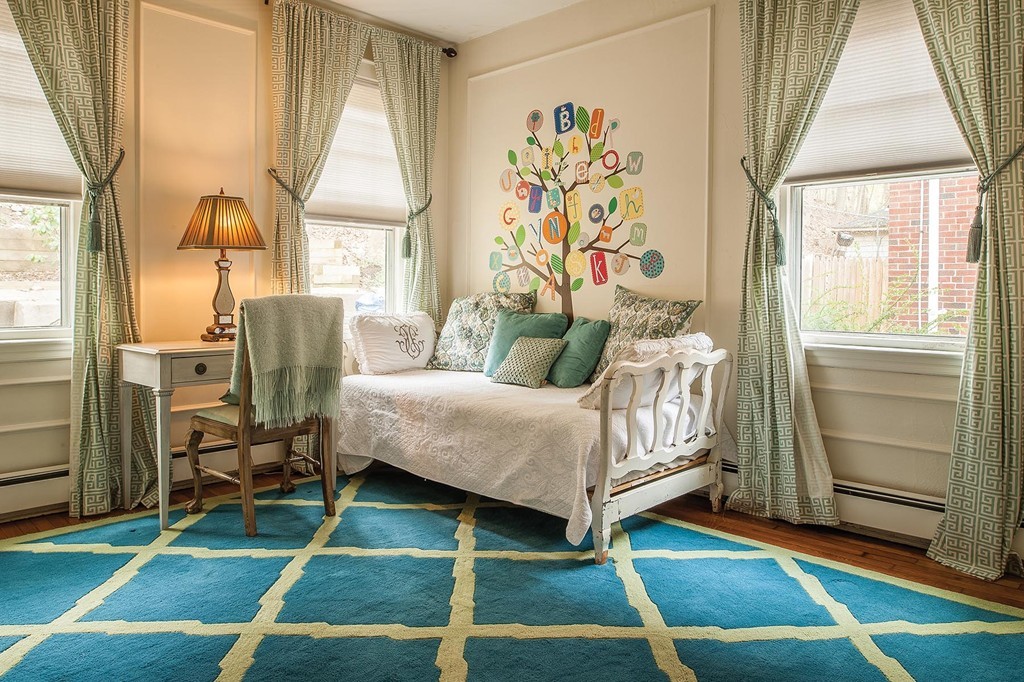 82 Atherton Road, Unit 1 Brookline, MA 02446 - Photo 6 of 9 a bedroom with a bed and a window