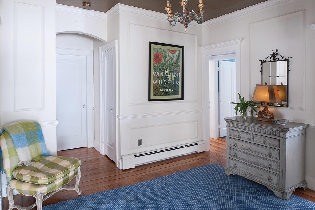 82 Atherton Road, Unit 1 Brookline, MA 02446 - Photo 8 of 9 a living room with furniture and a chandelier