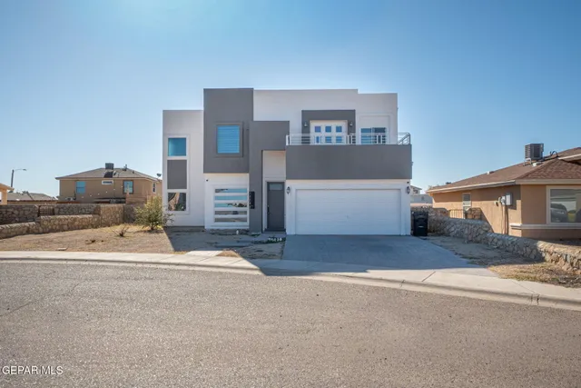 a spacious bedroom with a bed and a couch