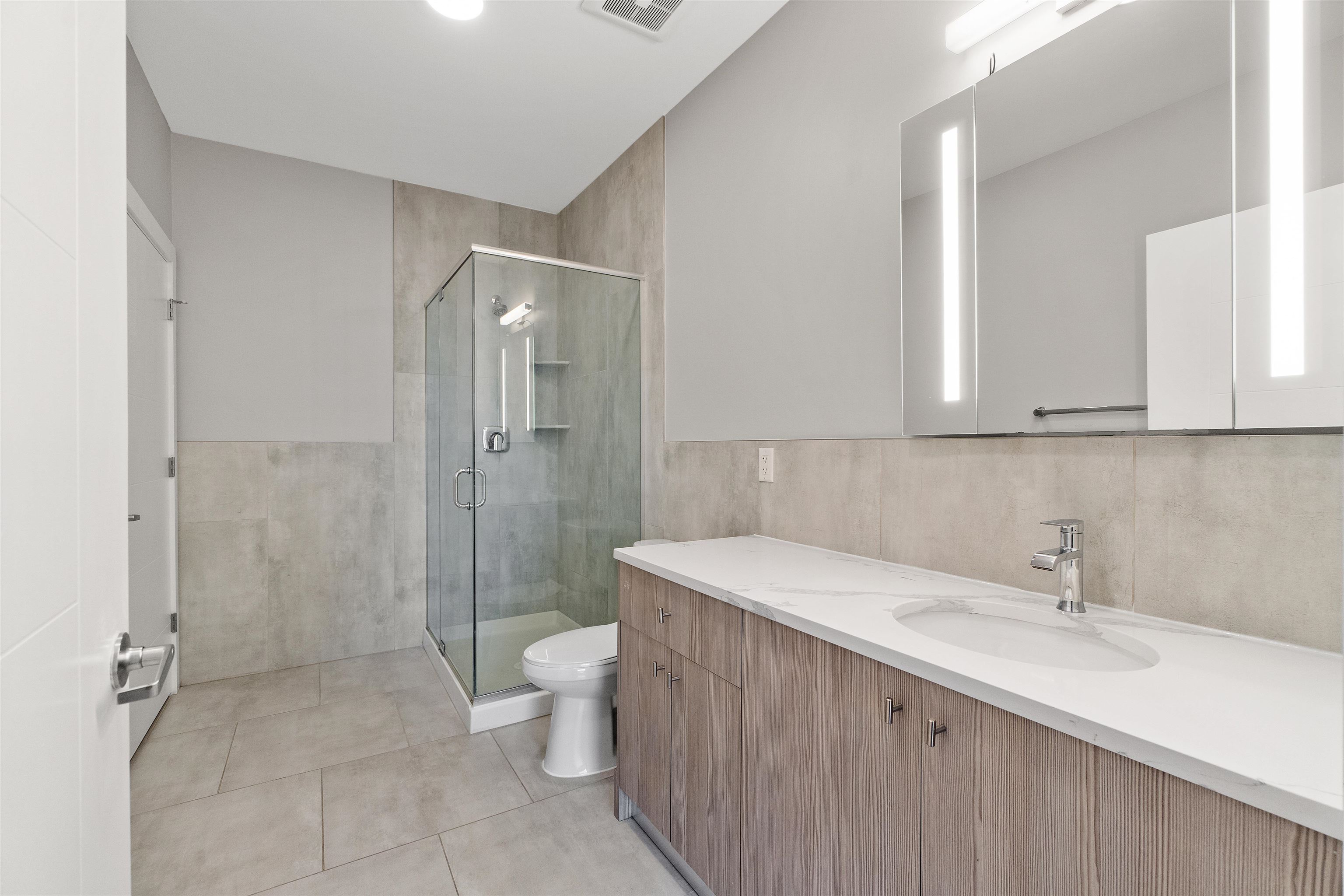 662 Avenue C, Unit 304 Bayonne, NJ 07002 - Photo 12 of 20 a bathroom with a sink toilet and shower