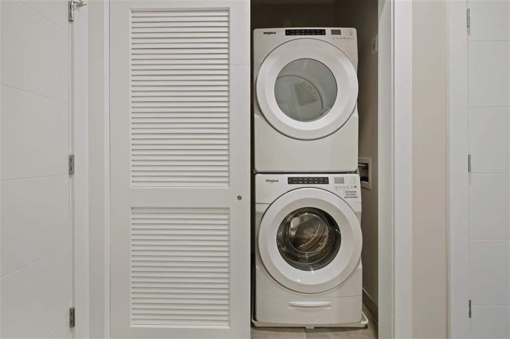 662 Avenue C, Unit 304 Bayonne, NJ 07002 - Photo 16 of 20 a utility room with dryer and washer