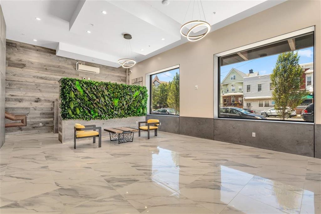 662 Avenue C, Unit 304 Bayonne, NJ 07002 - Photo 2 of 20 an outdoor space with chairs