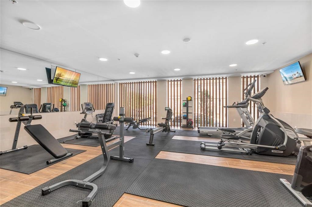 662 Avenue C, Unit 304 Bayonne, NJ 07002 - Photo 4 of 20 a room with lots of gym equipment