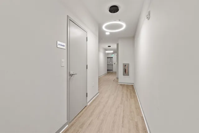 a view of a bathroom with a sink and a mirror