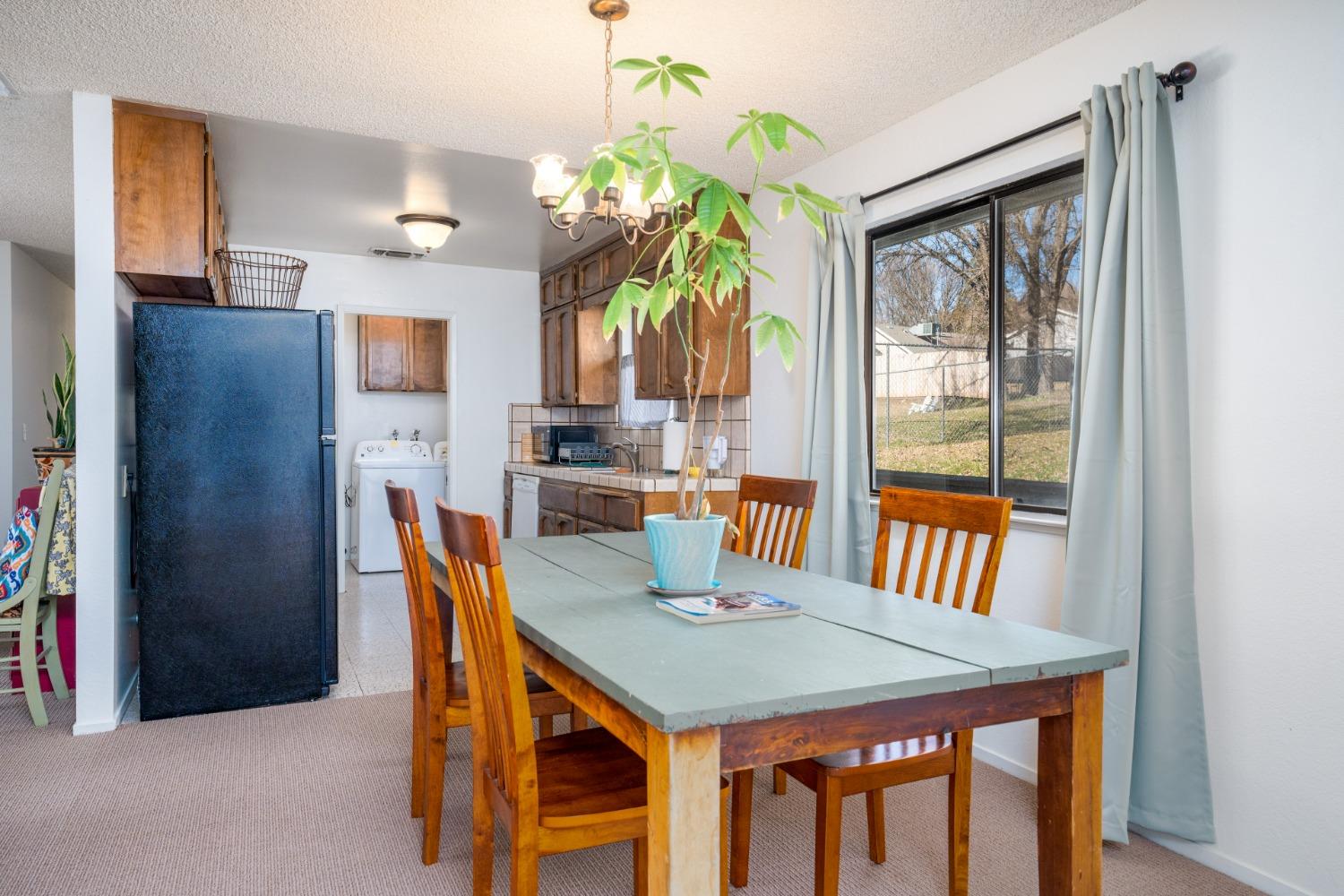 46011 Ming Circle Oakhurst, CA 93644 - Photo 11 of 37 a view of a dining room with furniture window and outside view
