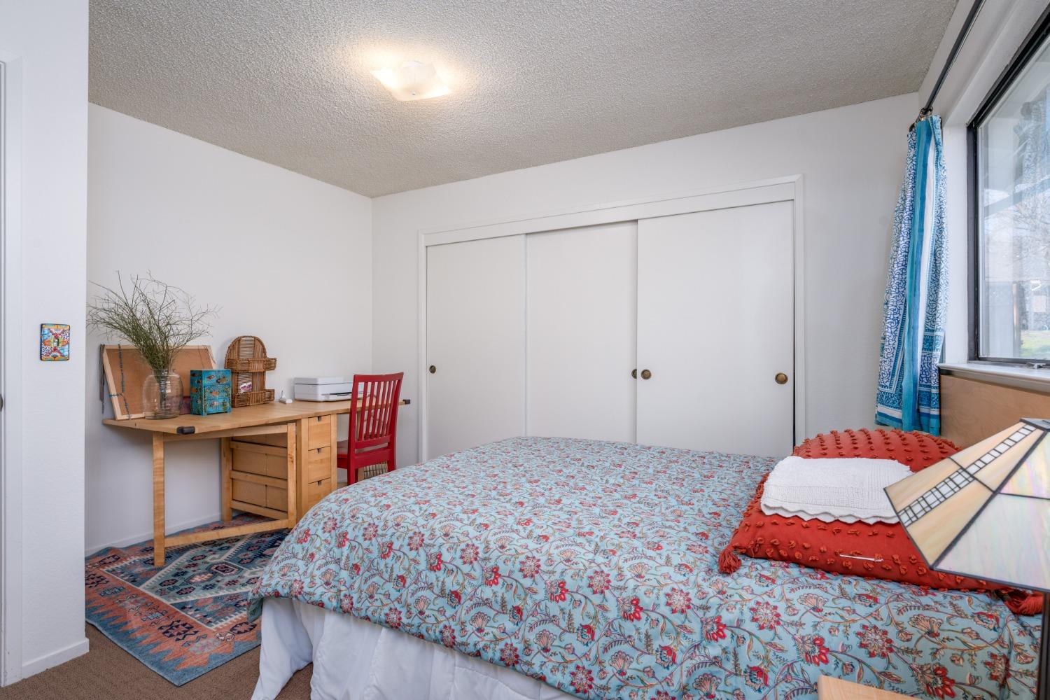 46011 Ming Circle Oakhurst, CA 93644 - Photo 25 of 37 a bedroom with a bed and a table in it