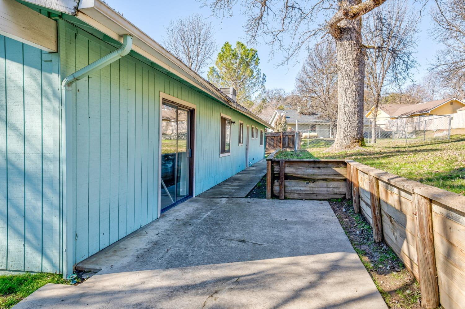 46011 Ming Circle Oakhurst, CA 93644 - Photo 28 of 37 a view of a house with backyard and sitting area
