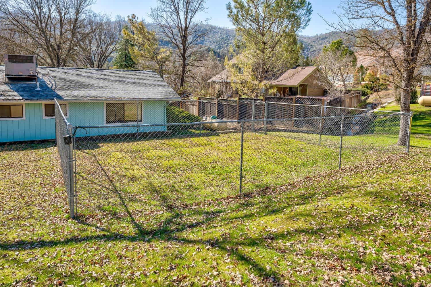 46011 Ming Circle Oakhurst, CA 93644 - Photo 35 of 37 a view of a house with a yard