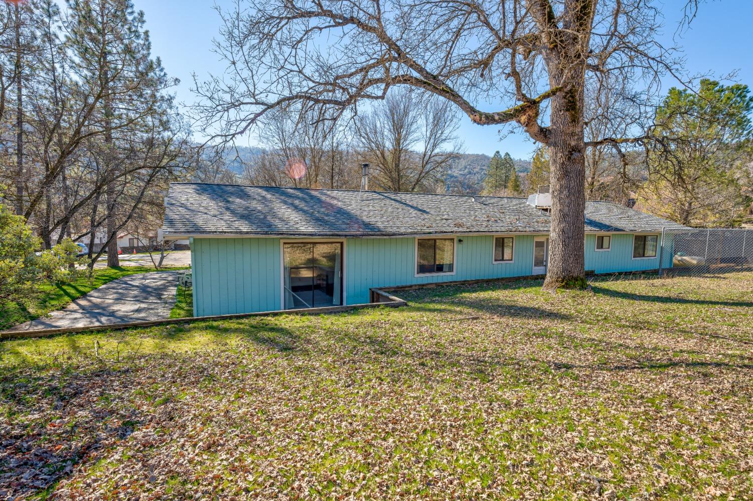 46011 Ming Circle Oakhurst, CA 93644 - Photo 36 of 37 a view of a house with a yard