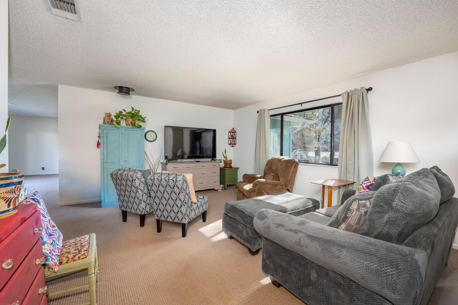 46011 Ming Circle Oakhurst, CA 93644 - Photo 8 of 37 a living room with furniture and wooden floor