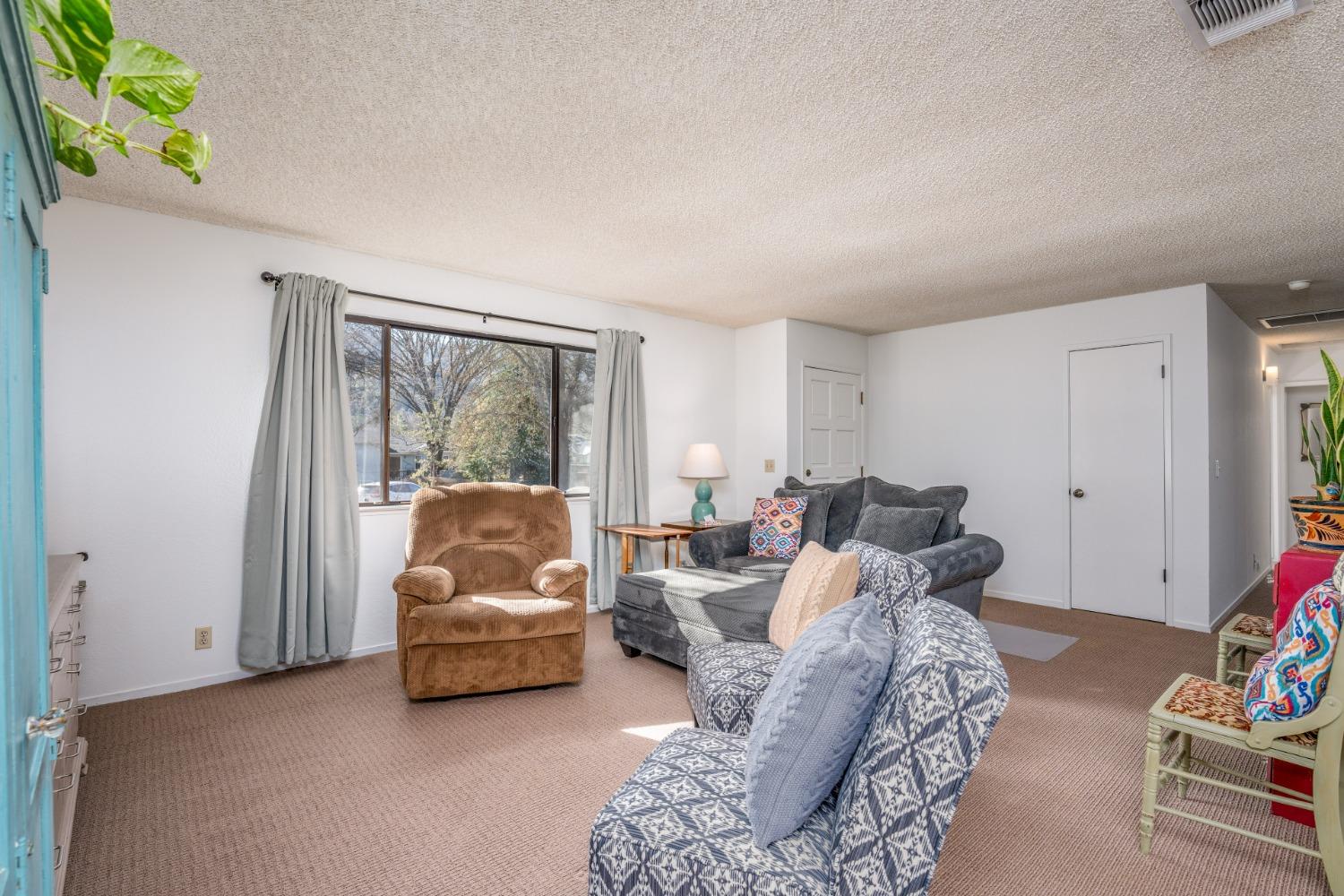 46011 Ming Circle Oakhurst, CA 93644 - Photo 9 of 37 a living room with furniture and a window