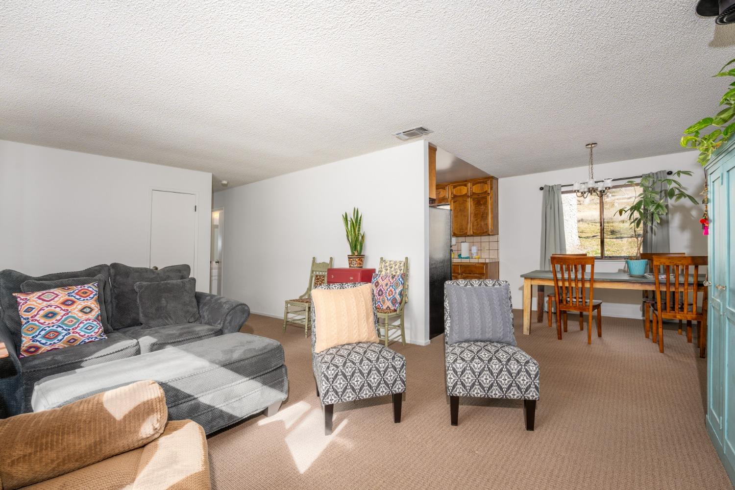 46011 Ming Circle Oakhurst, CA 93644 - Photo 10 of 37 a living room with furniture and a table