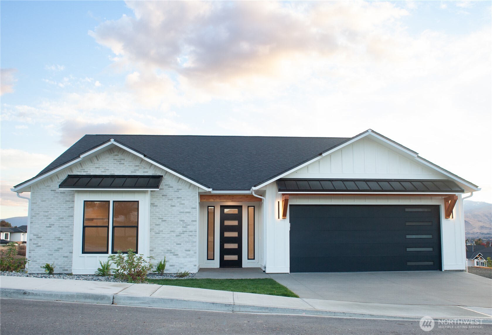 a front view of a house with garage