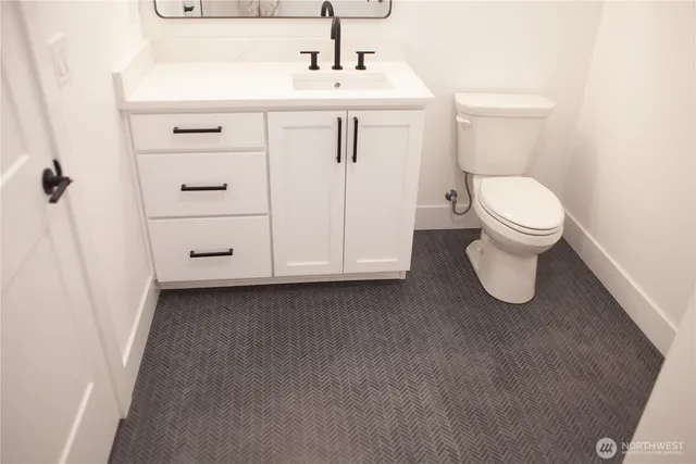 a view of hallway with wooden floor
