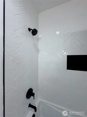 a kitchen with stainless steel appliances a sink stove and cabinets