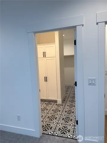 a bathroom with a sink a toilet a mirror and shower