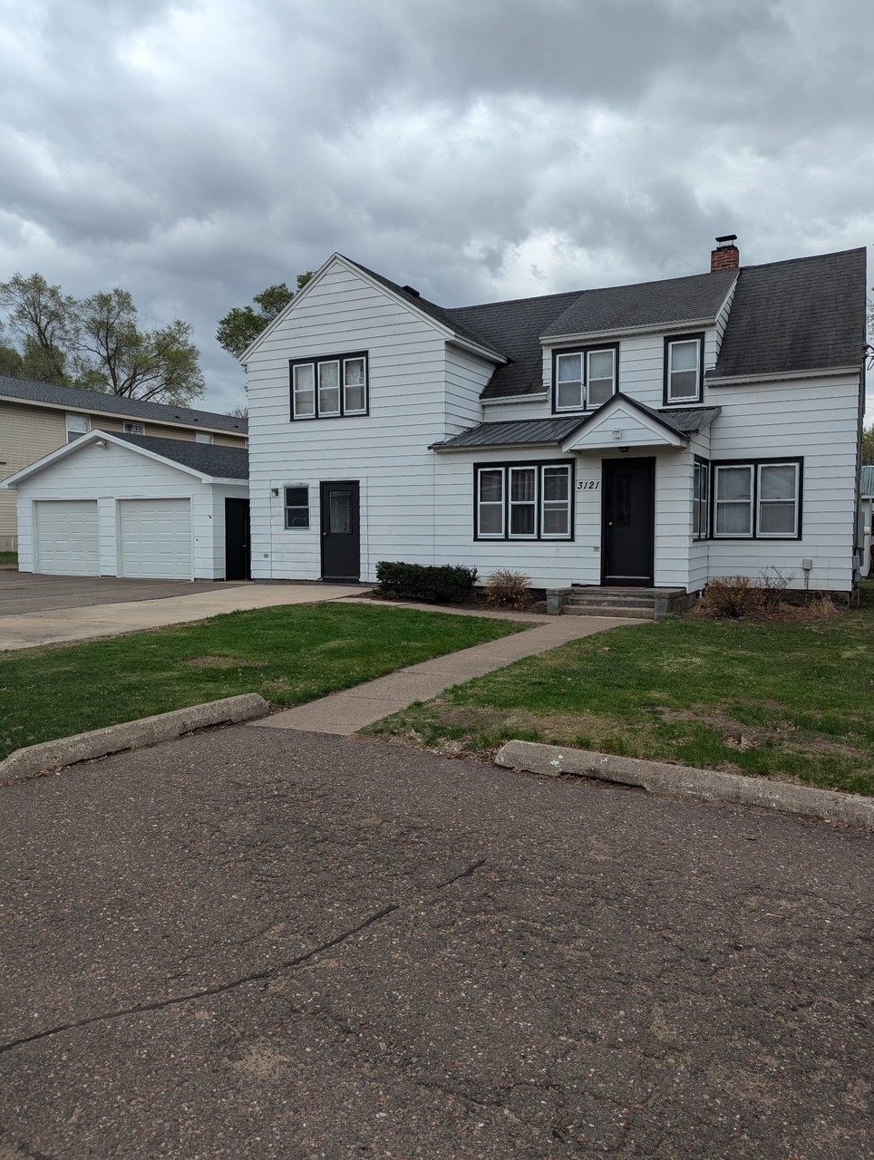 3121 Seymour Road, Unit 3 Eau Claire, WI 54703 - Photo 1 of 46 FRONT OF TRI-PLEX WITH VIEW OF DETACHED GARAGE