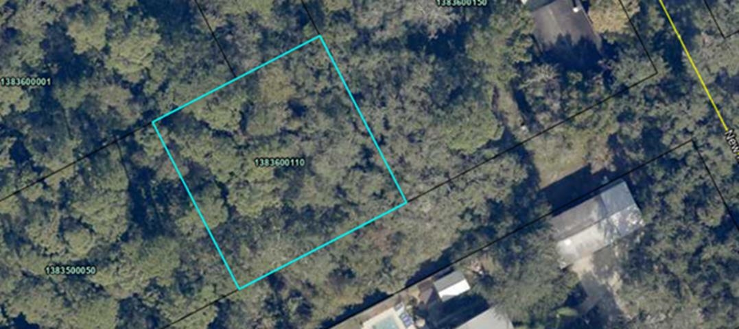 0 New Hampshire Road Elkton, FL 32033 - Photo 2 of 2 a city view with tall trees