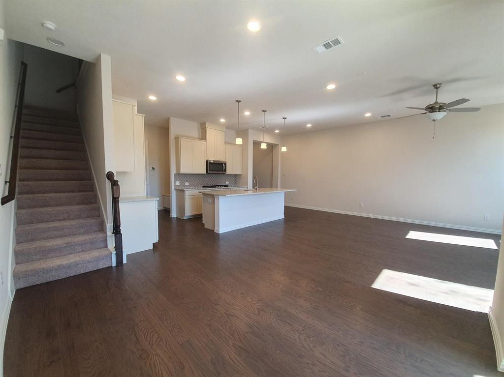 8286 Primrose Way Dallas, TX 75252 - Photo 9 of 25 a view of a kitchen with a sink and an oven