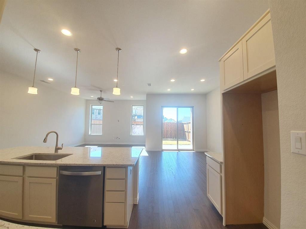 8286 Primrose Way Dallas, TX 75252 - Photo 23 of 25 a bathroom with a sink and mirror
