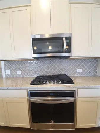 a view of kitchen with a sink and a floor to ceiling window