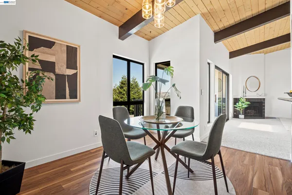 a dining room with furniture and window