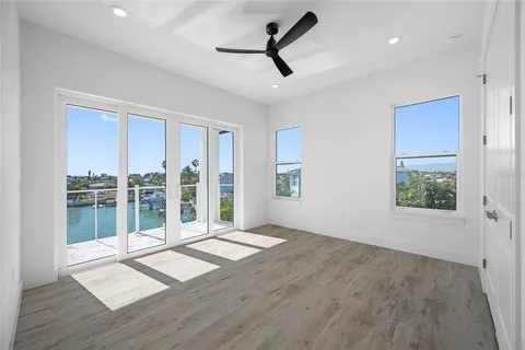 a spacious bathroom with a toilet a sink and a large mirror