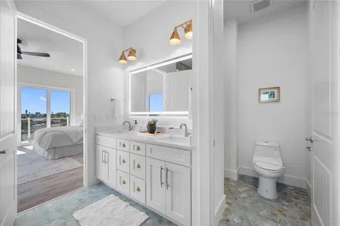 an aerial view of a city with lots of residential buildings lake and ocean view