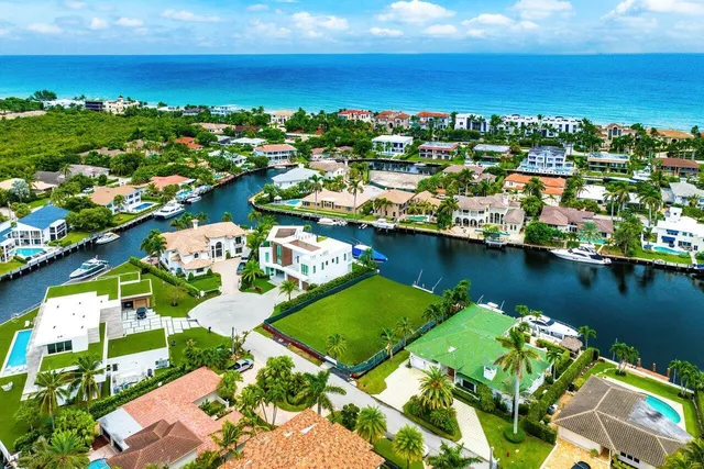 an aerial view of a house with a lake view