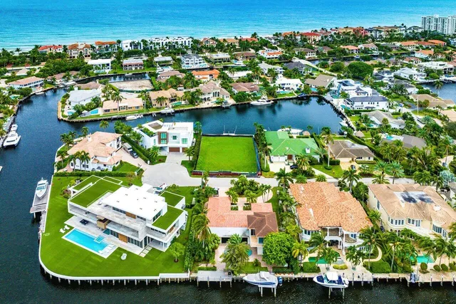 an aerial view of a house with a ocean view