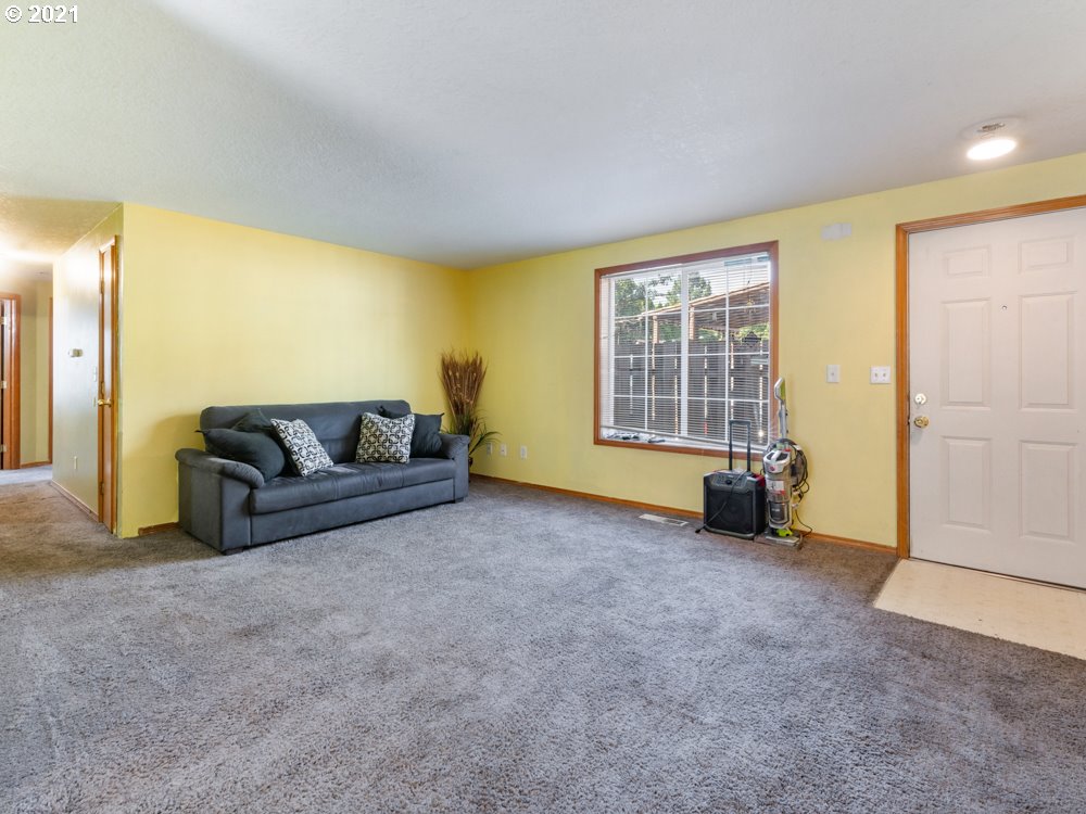 8106 Southeast Knight Street Portland, OR 97206 - Photo 15 of 29 a living room with furniture and a flat screen tv