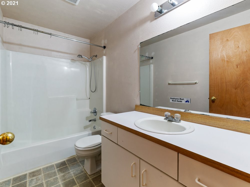 8106 Southeast Knight Street Portland, OR 97206 - Photo 21 of 29 a bathroom with a sink toilet tub and shower