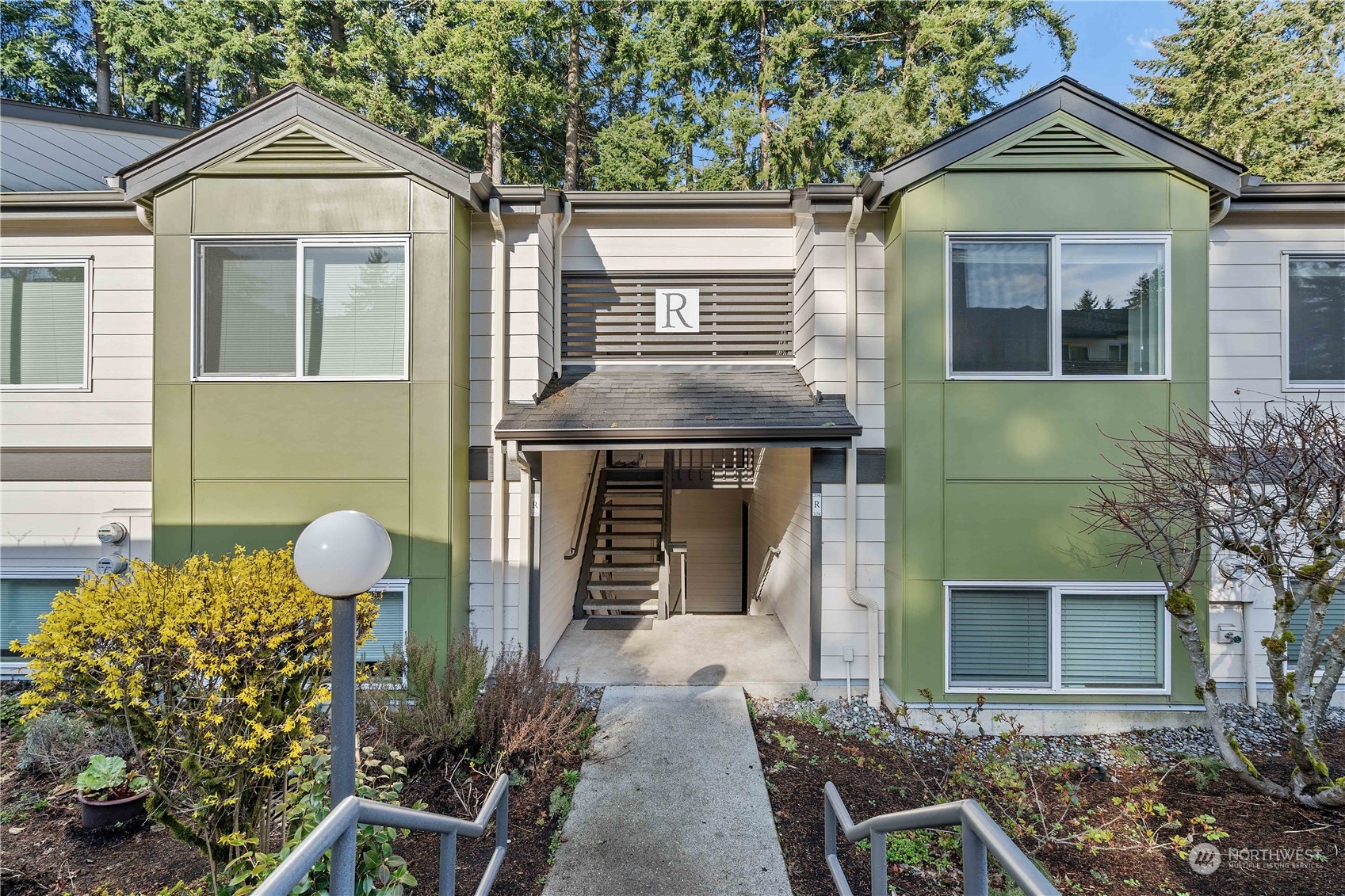 31500 33rd Place Southwest, Unit R204 Federal Way, WA 98023 - Photo 1 of 26 a front view of a house with garden