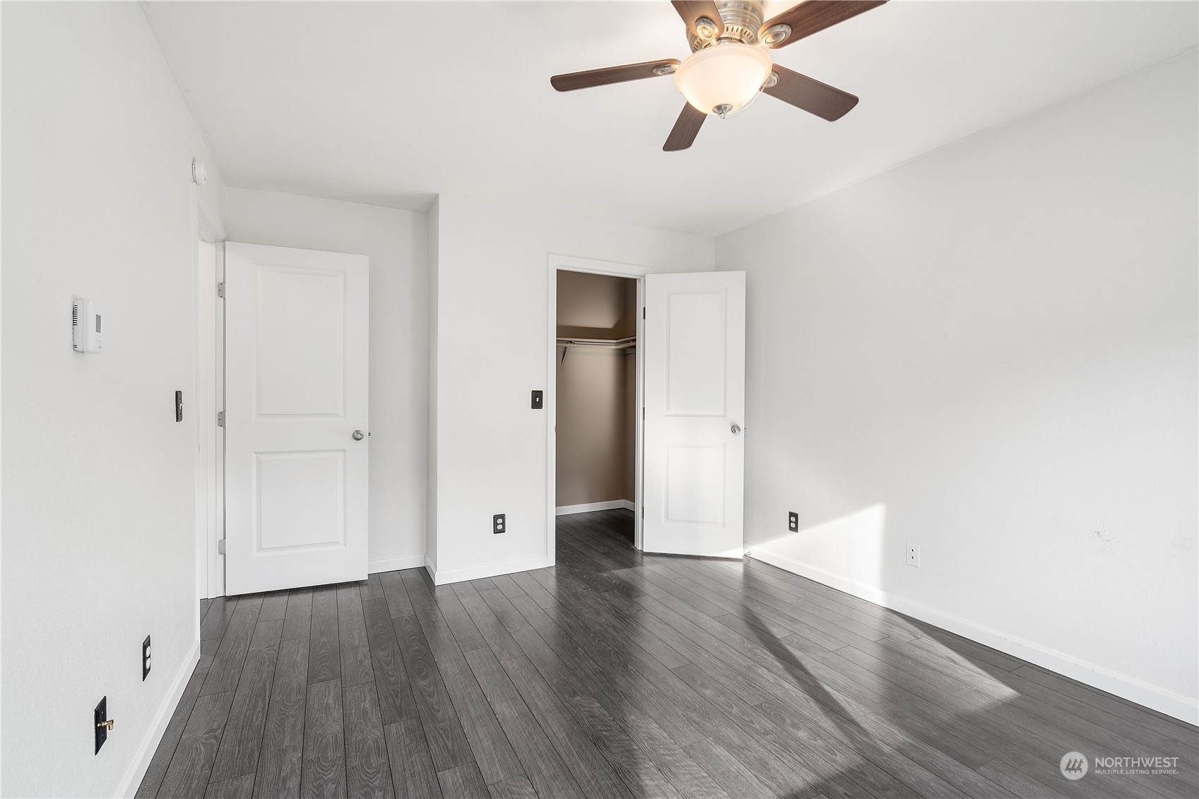 31500 33rd Place Southwest, Unit R204 Federal Way, WA 98023 - Photo 11 of 26 a view of an empty room with wooden floor