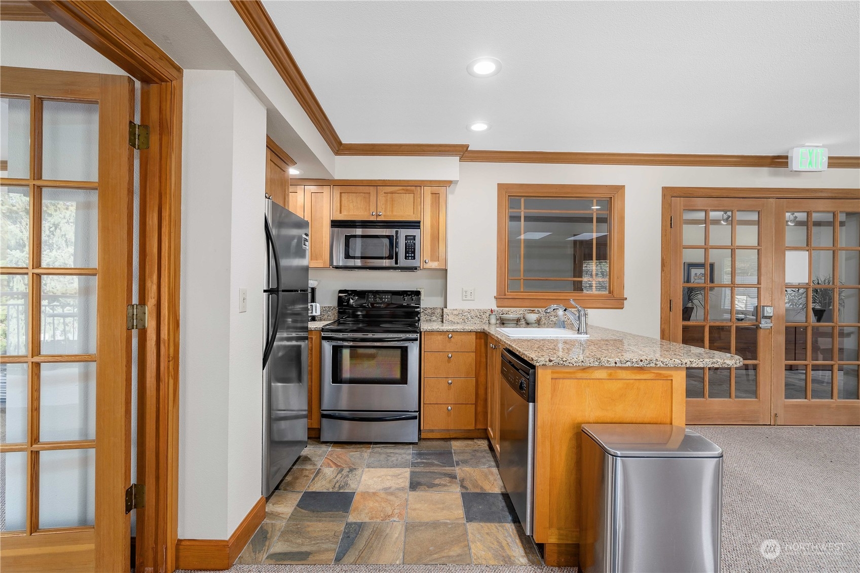 31500 33rd Place Southwest, Unit R204 Federal Way, WA 98023 - Photo 17 of 26 a kitchen with stainless steel appliances granite countertop a stove and a refrigerator
