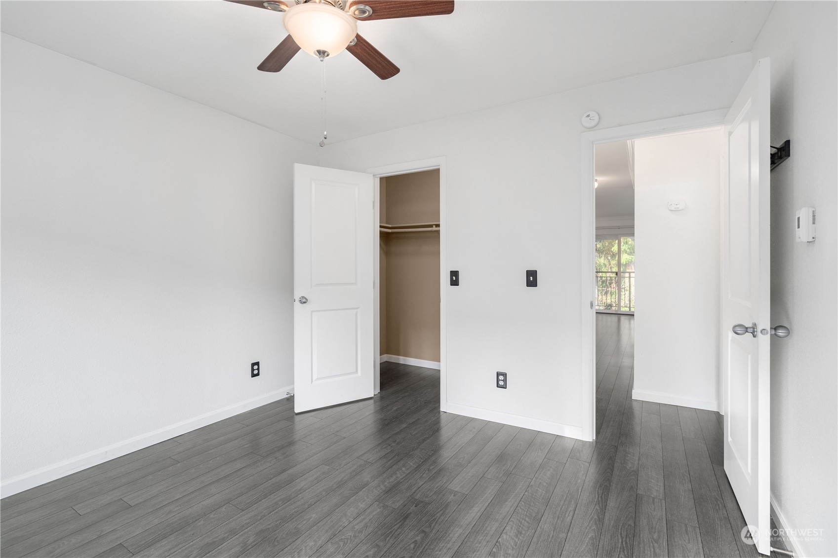 31500 33rd Place Southwest, Unit R204 Federal Way, WA 98023 - Photo 10 of 26 an empty room with wooden floor and ceiling fan