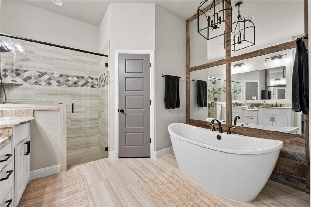 6365 Rhoden Avenue Godley, TX 76044 - Photo 18 of 31 a bathroom with a bathtub and shower