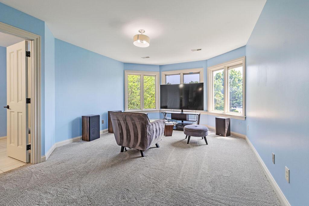2570 Jewett Road Powell, OH 43065 - Photo 57 of 104 • Grey carpet • Blue painted walls • Ceiling light • Bay wall • Closet with french doors • Jack & Jill bath access