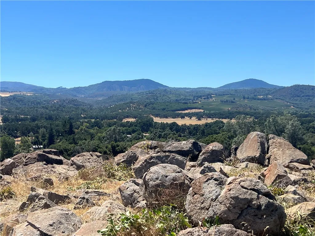 14155 5th Clearlake, CA 95422 - Photo 3 of 10 a view of a house with a mountain yard
