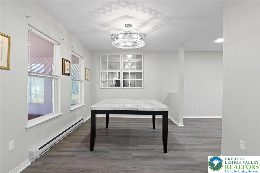 798 Sullivan Trail Scotrun, PA 18355 - Photo 11 of 46 a view of an empty room with wooden floor and a window