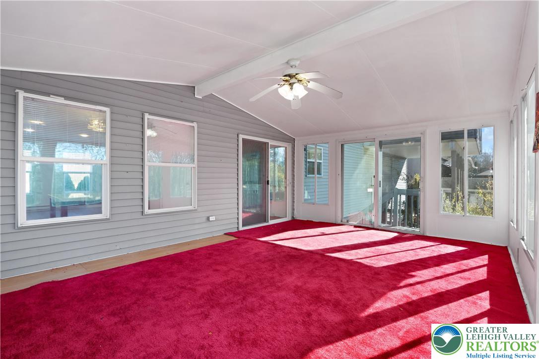 798 Sullivan Trail Scotrun, PA 18355 - Photo 16 of 46 a bedroom with a large bed and a large window