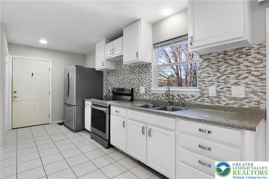 798 Sullivan Trail Scotrun, PA 18355 - Photo 18 of 46 a kitchen with stainless steel appliances a sink cabinets and a counter top space