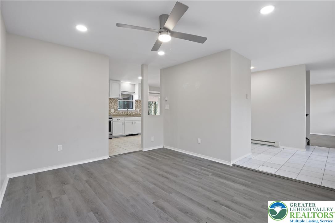 798 Sullivan Trail Scotrun, PA 18355 - Photo 20 of 46 a view of a kitchen with wooden floor and a ceiling fan