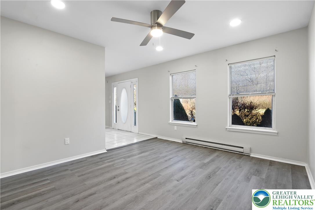 798 Sullivan Trail Scotrun, PA 18355 - Photo 22 of 46 an empty room with wooden floor and ceiling fan