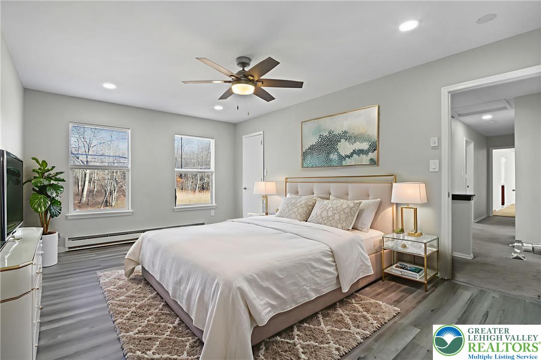 798 Sullivan Trail Scotrun, PA 18355 - Photo 29 of 46 a bedroom with a large bed and a window